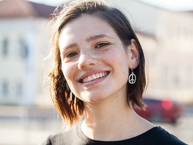 smiling young girl in the sunshine